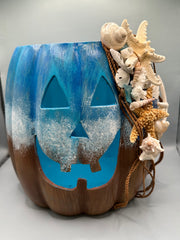 Front view of the Nautical Jack-O-Lantern with seashell and starfish embellishments.