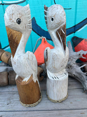 Wooden Pelican Standing on Piling Statue