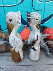 Wooden Pelican Standing on Piling Statue