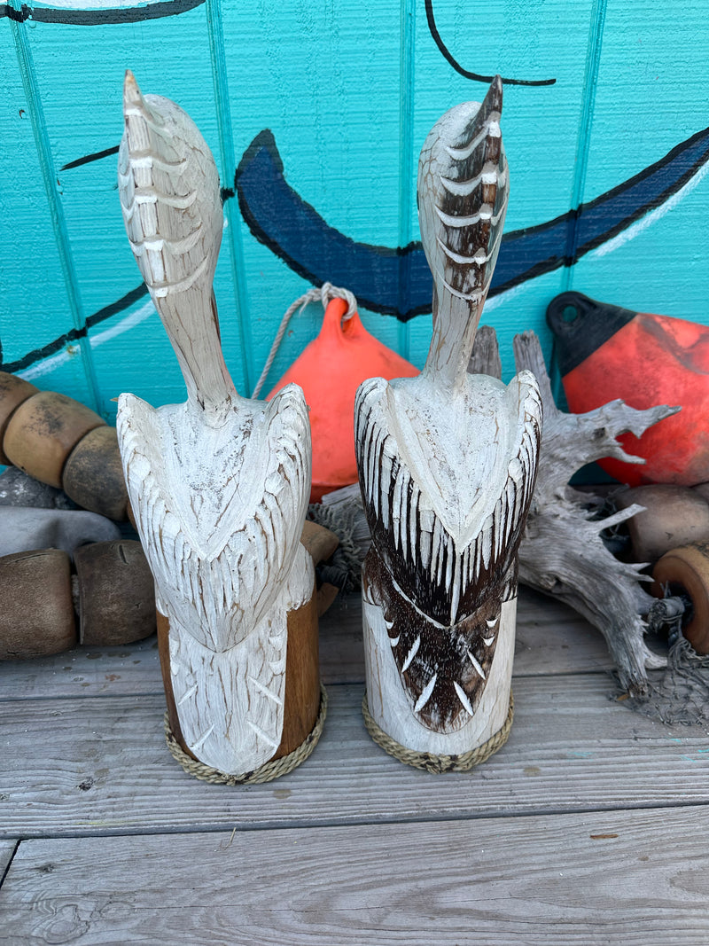 Wooden Pelican Standing on Piling Statue