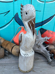 Wooden Pelican Standing on Piling Statue