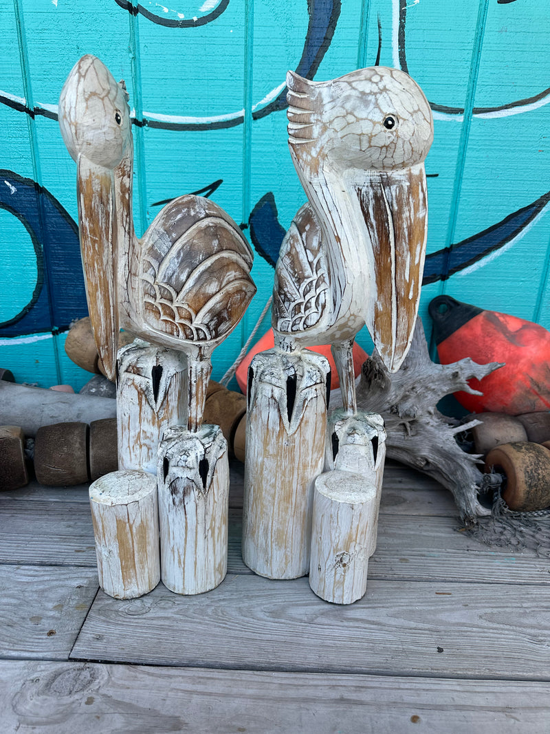 Wooden Pelican Standing on Multiple Piling Statue