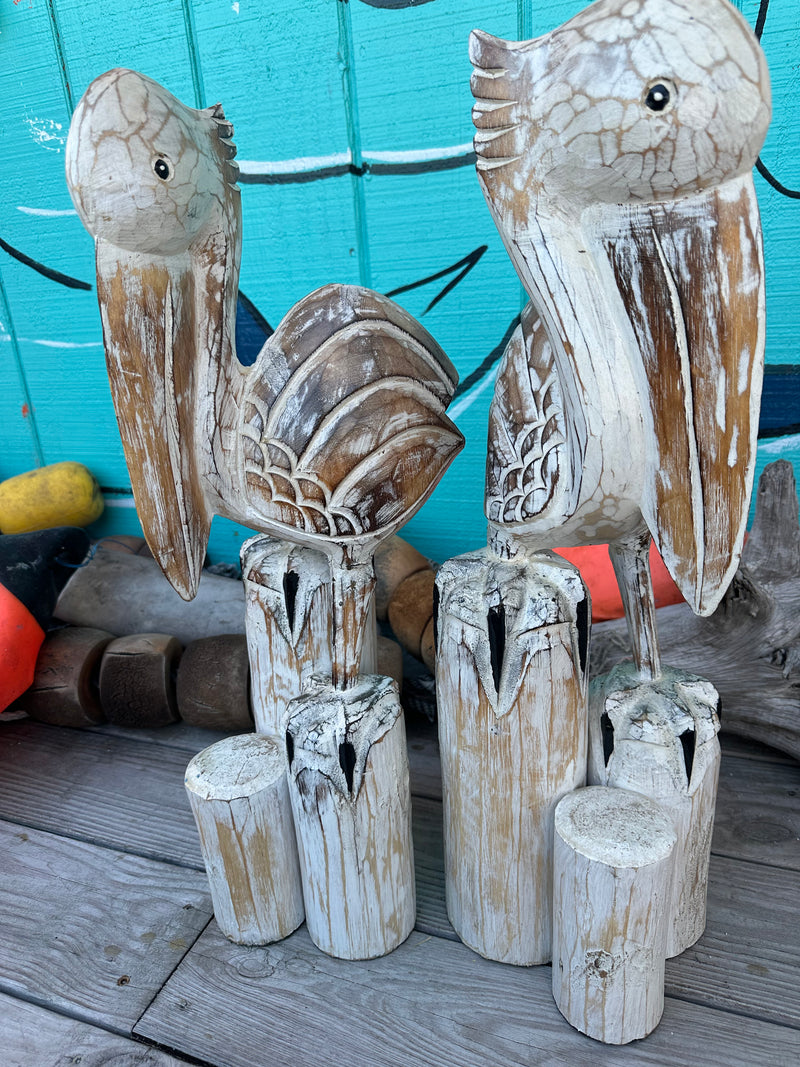 Wooden Pelican Standing on Multiple Piling Statue