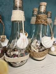 Glass Bottle With Seashell And Sand