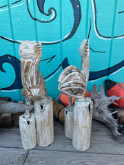 Wooden Pelican Standing on Multiple Piling Statue