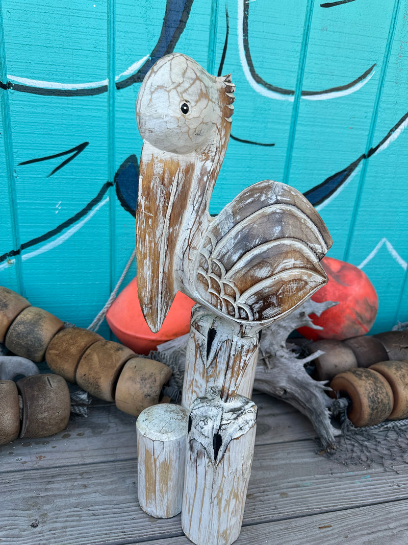 Wooden Pelican Standing on Multiple Piling Statue