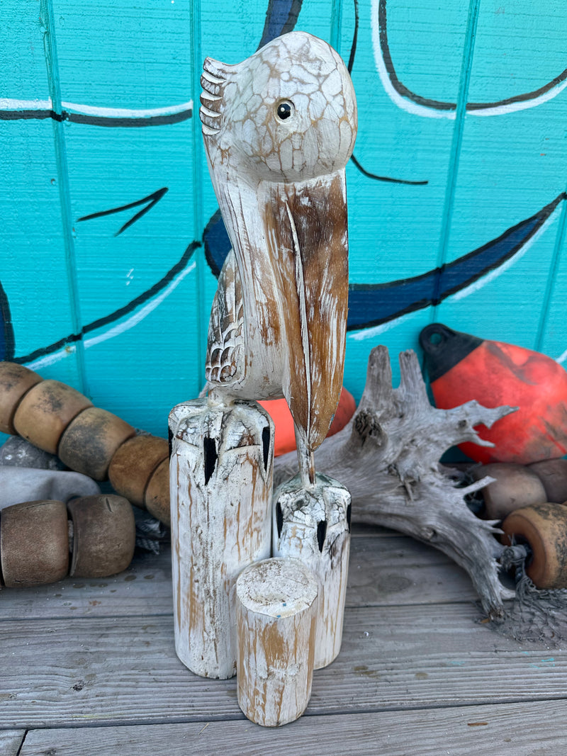 Wooden Pelican Standing on Multiple Piling Statue