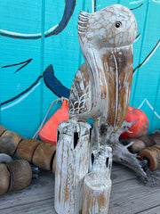 Wooden Pelican Standing on Multiple Piling Statue