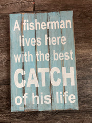 A Fisherman Lives Here Sign