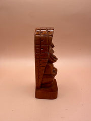 Side view of the Hawaii Tiki God of Strength Ku wooden statue, highlighting the intricate profile and carved texture.