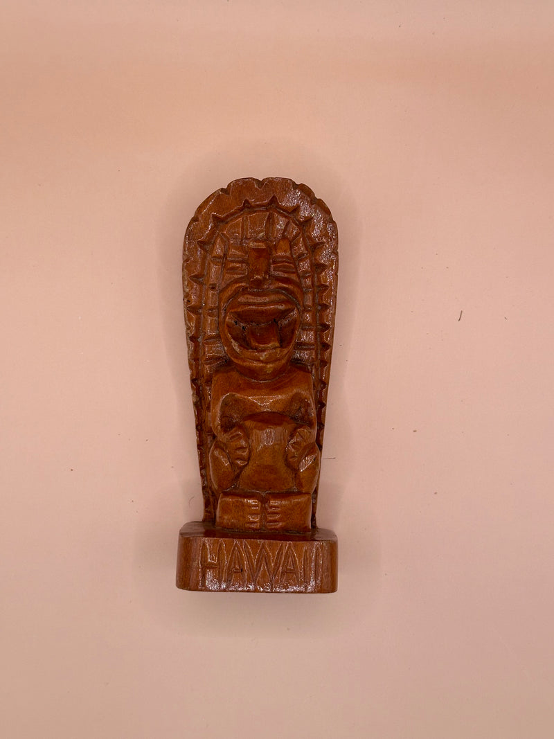 Top-down view of the Hawaii Tiki God of Strength Ku wooden statue, showcasing the full carving detail from above.