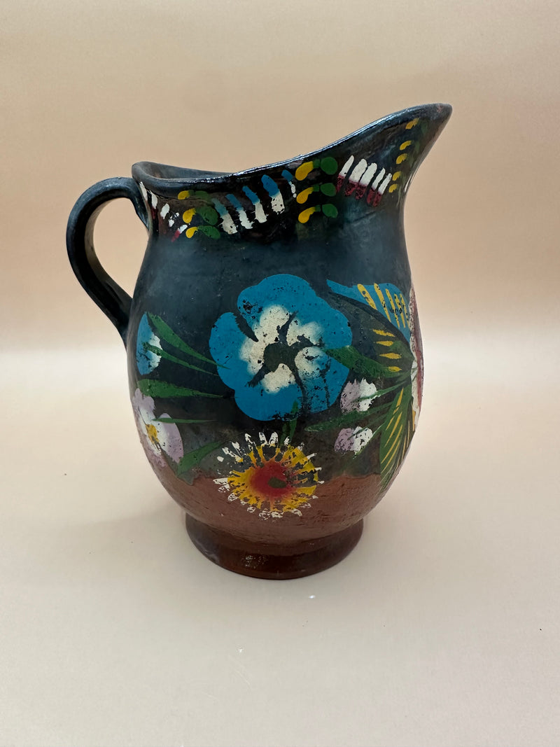 Side view of the Vintage Handmade Ceramic Pitcher featuring intricate hand-painted flowers.