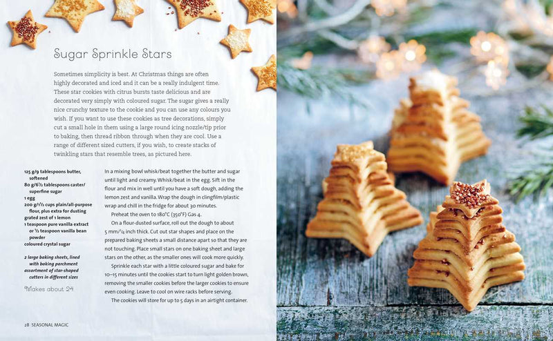 Baked star-shaped cookies with sugar sprinkles on a wooden surface with Christmas decorations.