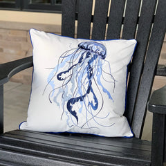 Blue Jellyfish Embroidered Pillow set on an outdoor black chair, emphasizing its suitability for outdoor use.