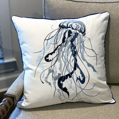 Blue Jellyfish Embroidered Pillow styled on a sofa, blending beautifully with indoor coastal decor.