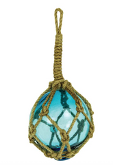 Light blue glass buoy float wrapped in natural jute rope netting with visible bubbles and aged coastal finish.