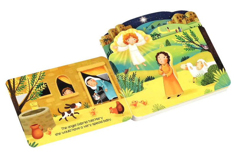 Children's book with illustrated scenes of a nativity story on a white background