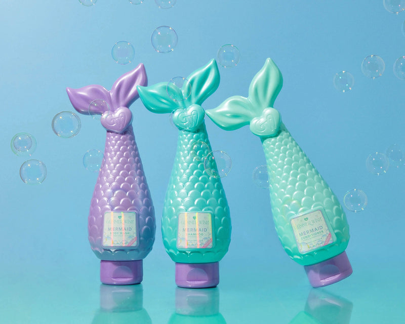 Mermaid Shampoo bottles in aqua, pink, and lavender shades displayed together on teal background.