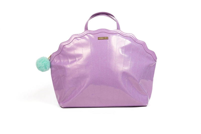 Iridescent lilac Mermaid Shell Overnight Bag with teal pom charm and curved shell shape.