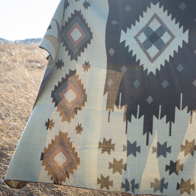 Close-up of the Mojave blanket's geometric pattern, focusing on the central cream and brown diamond motifs.