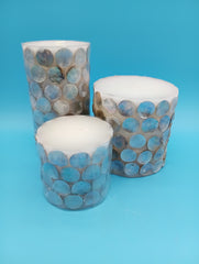 Add seaside elegance with mother of pearl shell accent candles. Available in 3 sizes, perfect for coastal home décor, gifts, or centerpie