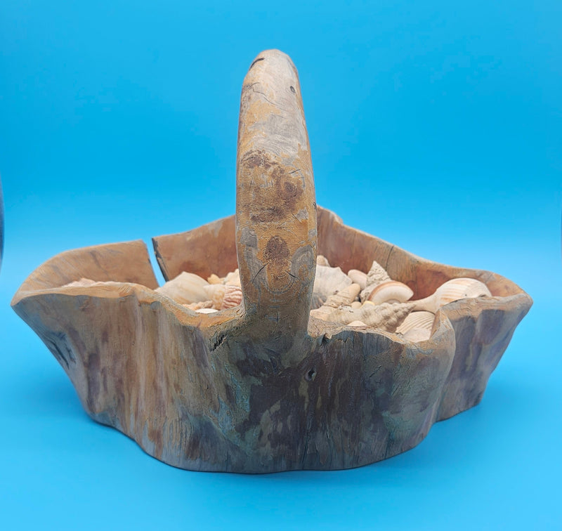Ocean-inspired shell basket in carved wood – seaside centerpiece