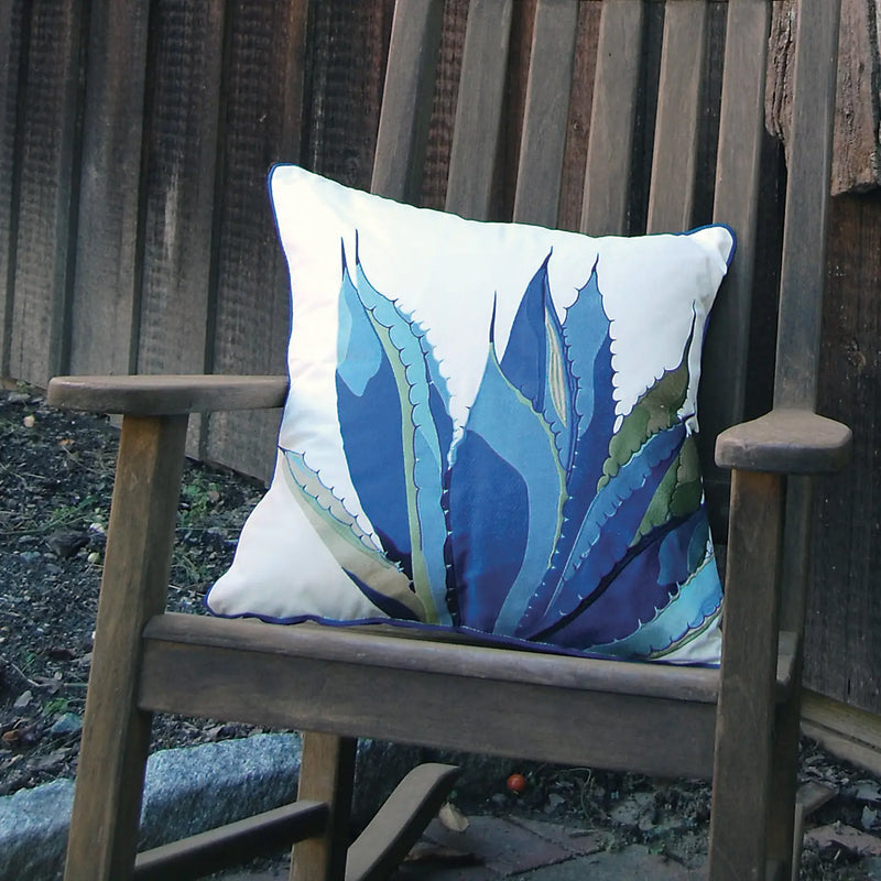 Agave-Tequila Maker Pillow styled in an outdoor patio setting, adding a bold and artistic touch to the decor.