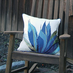 Agave-Tequila Maker Pillow styled in an outdoor patio setting, adding a bold and artistic touch to the decor.