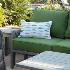 Sea Glass Fish Pattern Pillow styled in an outdoor patio setting, adding a coastal touch to the decor.