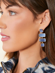 Quad Earrings – Model Wearing Blue and Gold Earrings