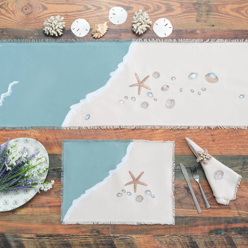 Sand & Shells Table Runner styled on a wooden dining table with beach-inspired decor, showcasing its coastal charm.