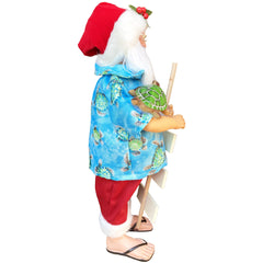 Left side view of Save the Turtles Claus Santa figurine holding sign and sea turtle coastal Christmas décor