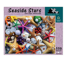 Seaside Stars 550-piece jigsaw puzzle box featuring colorful starfish and sand dollars, showcasing coastal treasures.