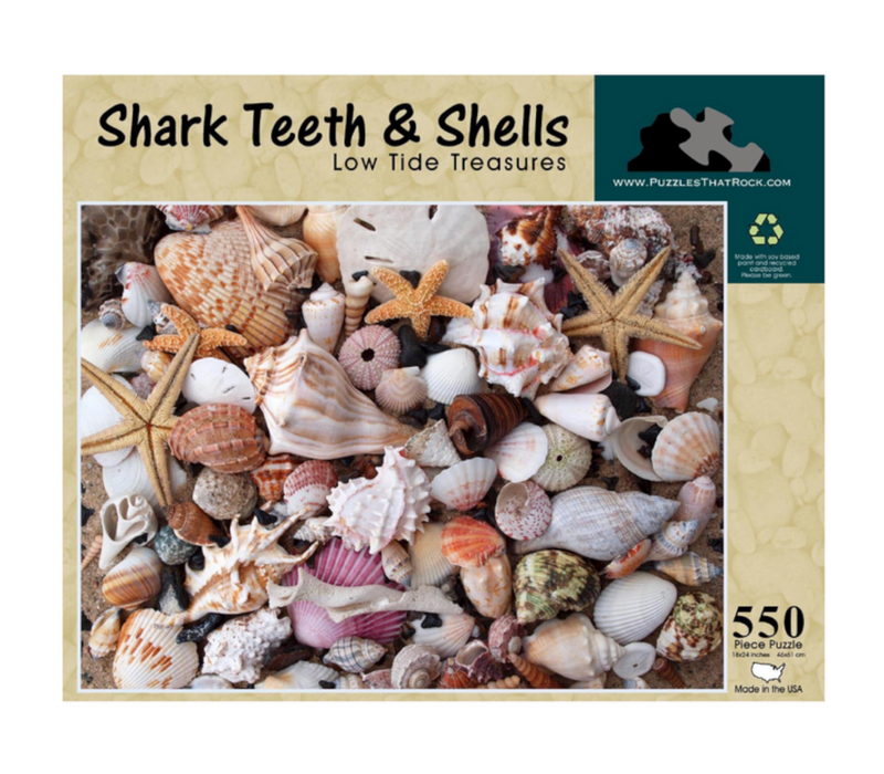 Shark Teeth and Shells jigsaw puzzle box showcasing a collection of real shells and shark teeth, 550 pieces.