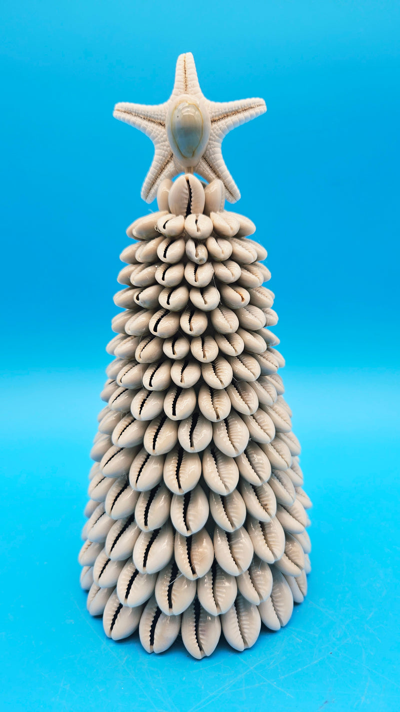 Close-up of the natural white starfish sitting atop the Cowrie Shell Christmas Tree.