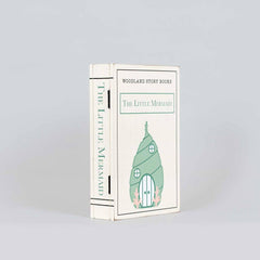 Book titled 'The Little Mermaid' from Woodland Story Books on a light gray background