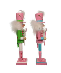 Two decorative nutcrackers in pink and green outfits on a white background