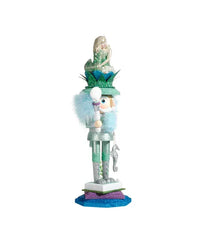 Side view of mermaid king nutcracker with mermaid crown and shell scepter