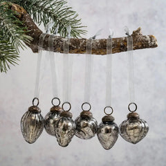 Six different designs of slate crackle glass baubles displayed for Christmas decor