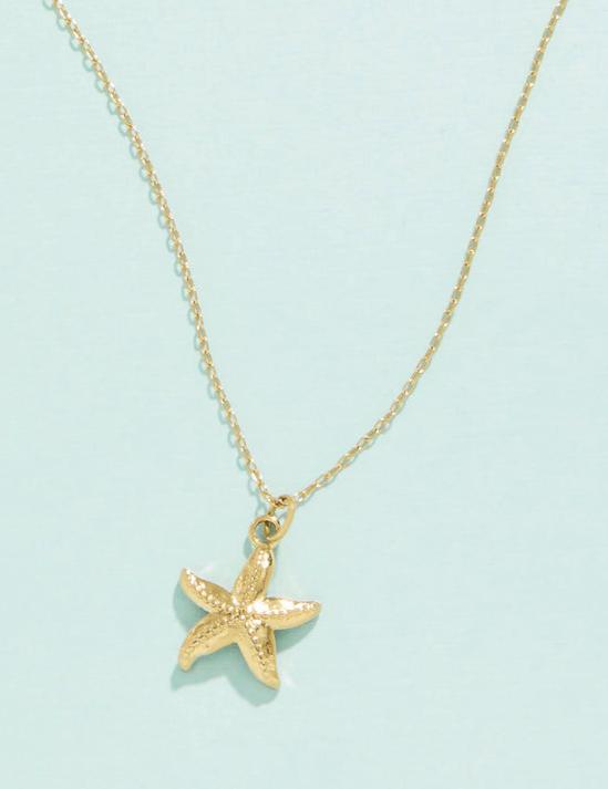 Gold-plated starfish necklace on 18" chain with lobster clasp, displayed on a light background.