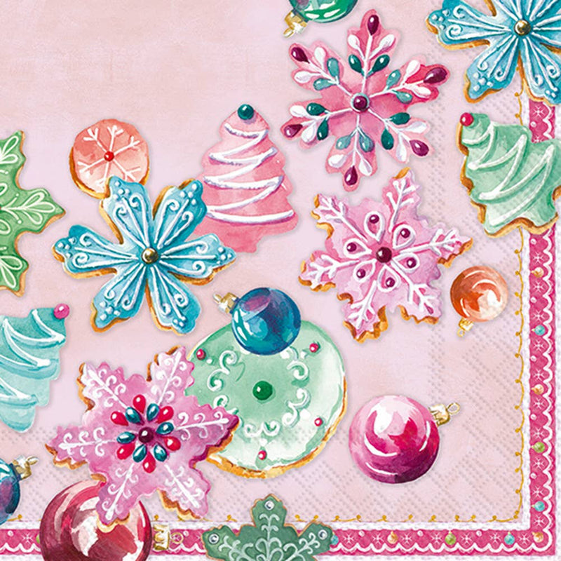 Decorative paper with colorful Christmas-themed cookies on a pink background