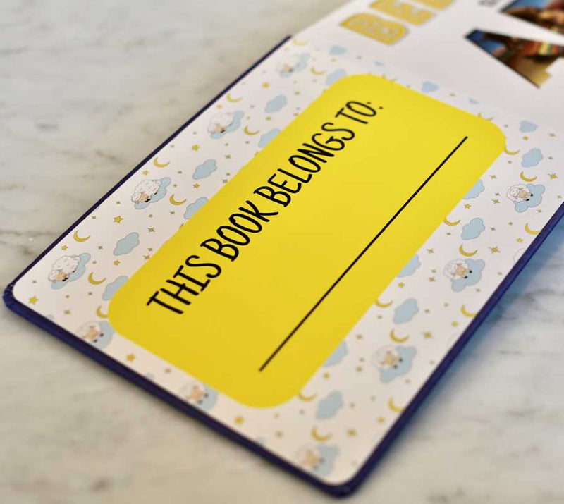 Book with a yellow label on a marble surface