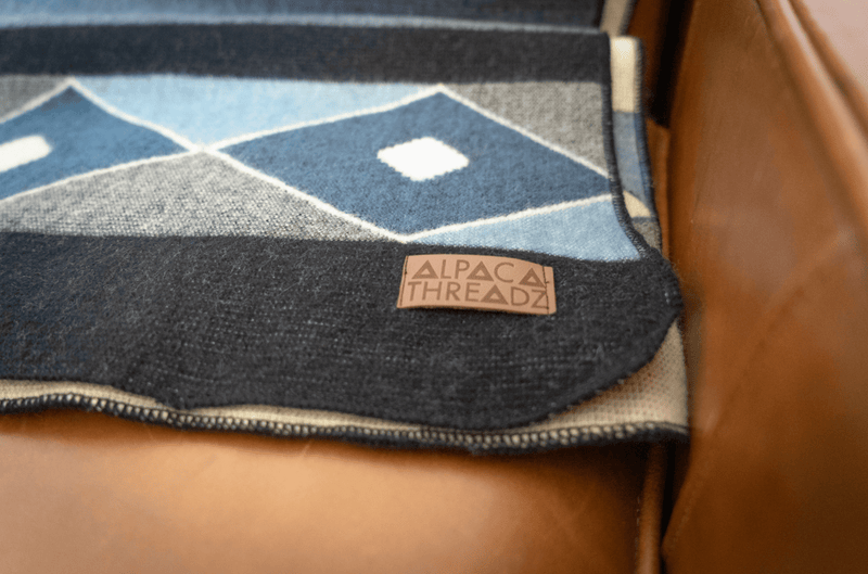 Alpaca wool throw blanket in midnight geometric pattern - Andean home textile
