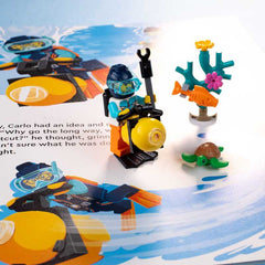 LEGO diver minifigure with underwater accessories on a book page