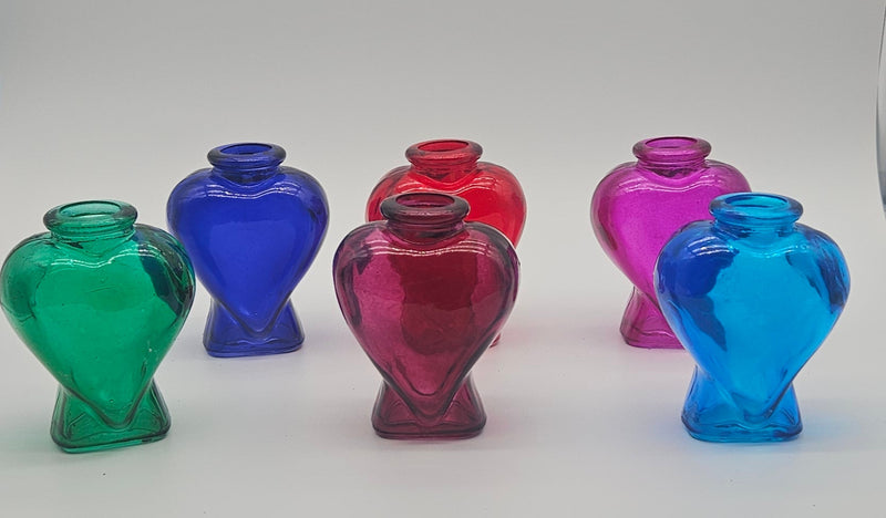 Set of colorful glass bottles – coastal décor accents in aqua, blue, pink, red, green, and purple