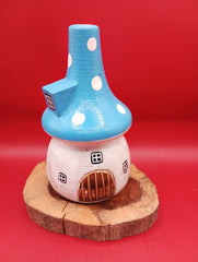 Wooden mushroom house accent with blue polka dot roof and rustic wood base – fairy garden accent