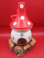 Wooden mushroom house accent with red polka dot roof and rustic wood base – patio garden decor