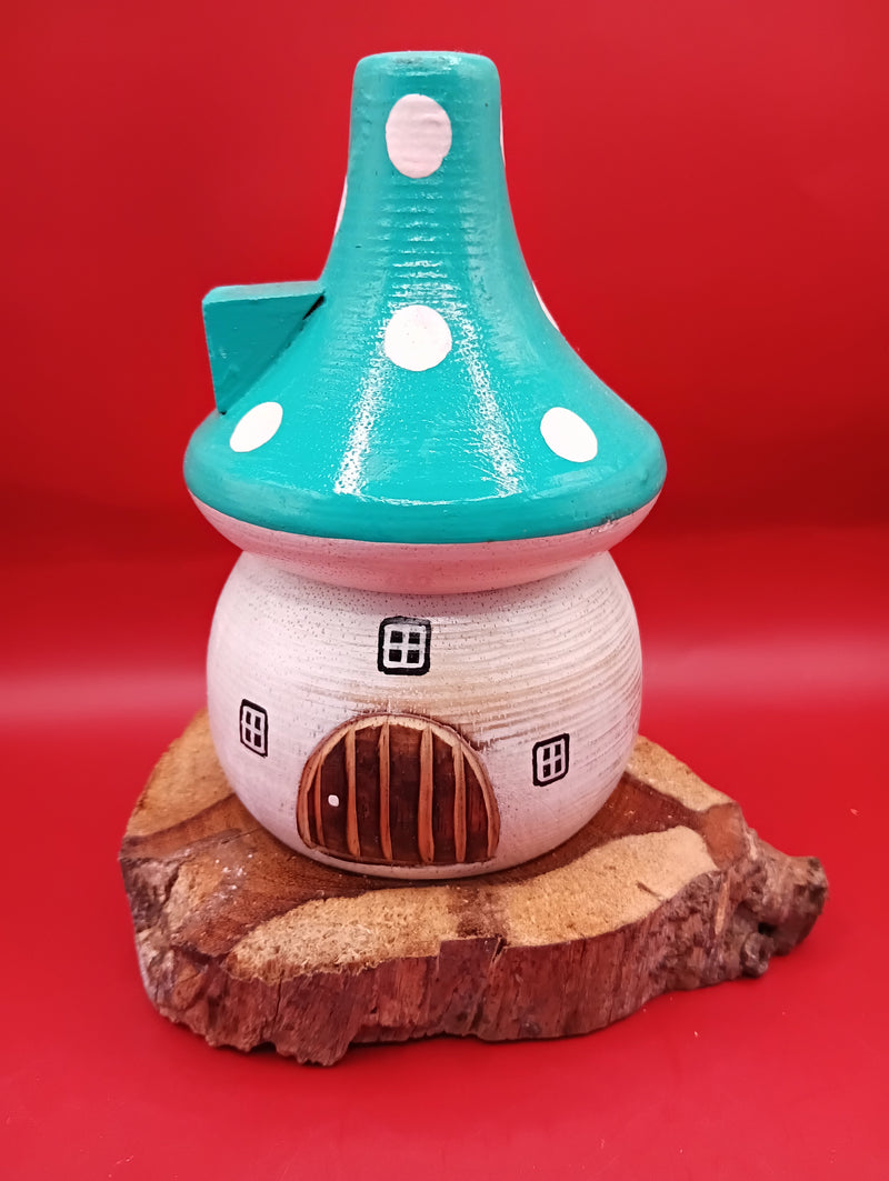 Wooden mushroom house accent with teal polka dot roof and rustic wood base – coastal garden accent