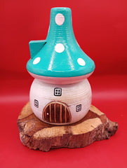Wooden mushroom house accent with teal polka dot roof and rustic wood base – coastal garden accent