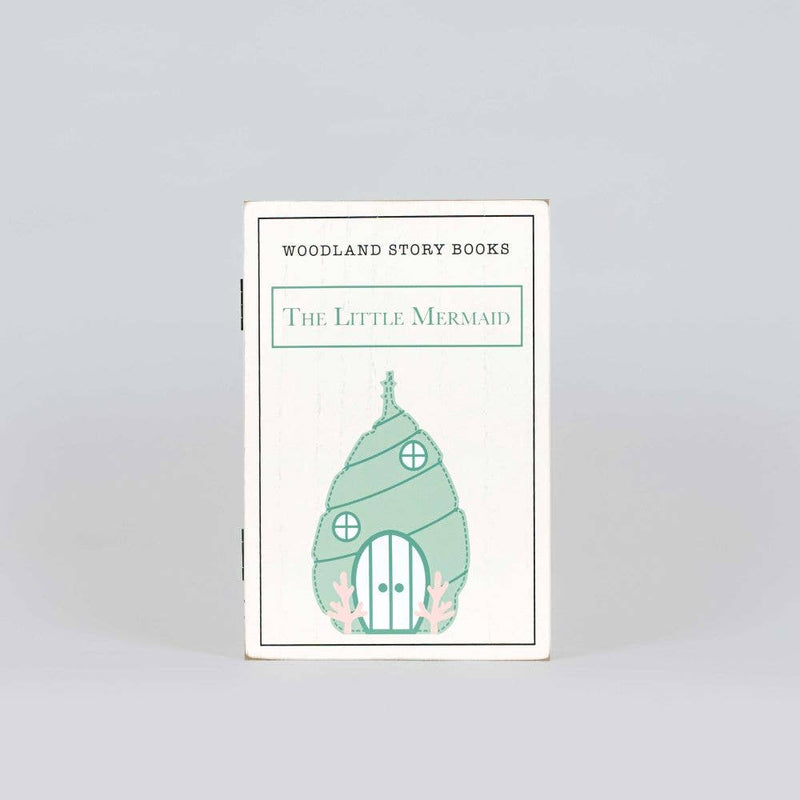 Book titled 'The Little Mermaid' from Woodland Story Books on a light gray background